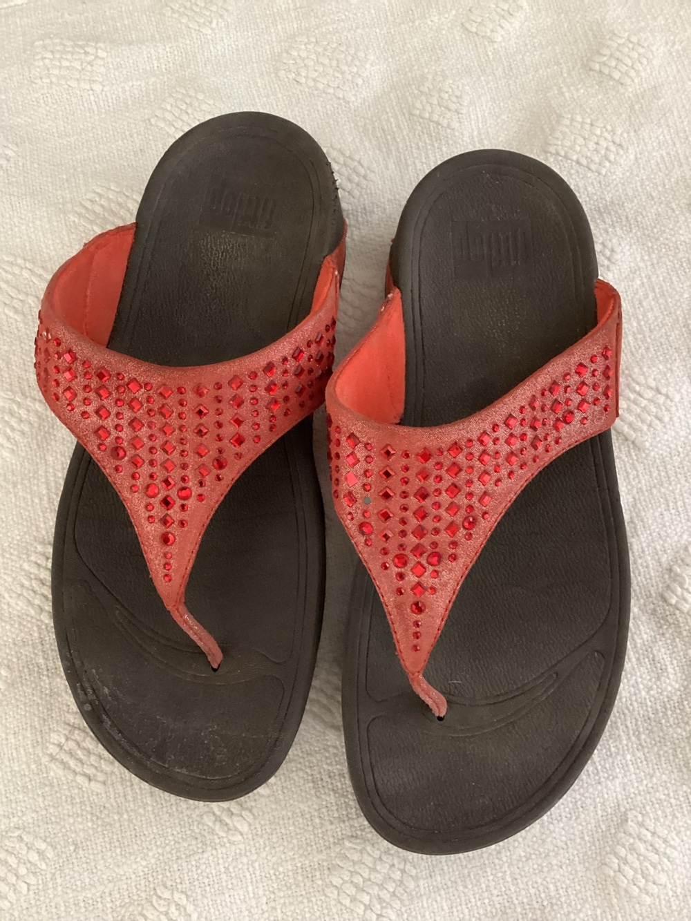 FitFlop Novy sandal with red jewel embellishments.